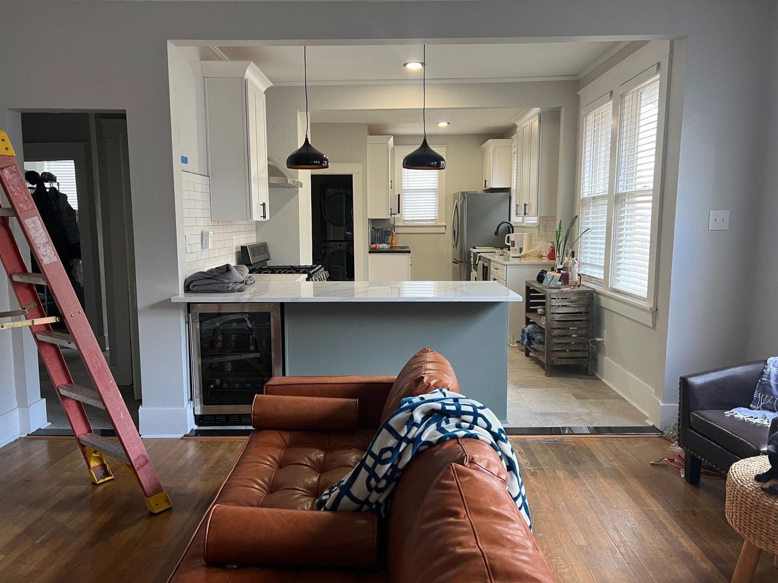 Remodeled kitchen with pendant and recessed lighting