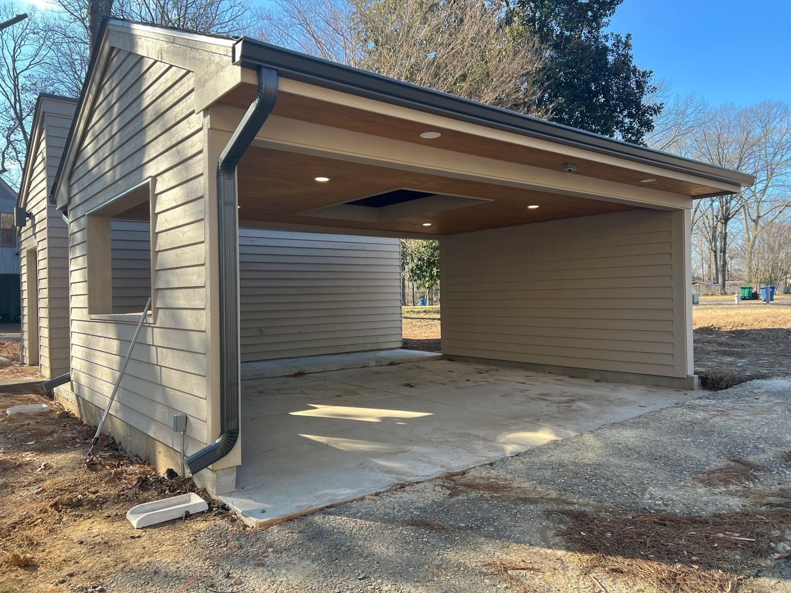 Carport with recessed soffit lighting