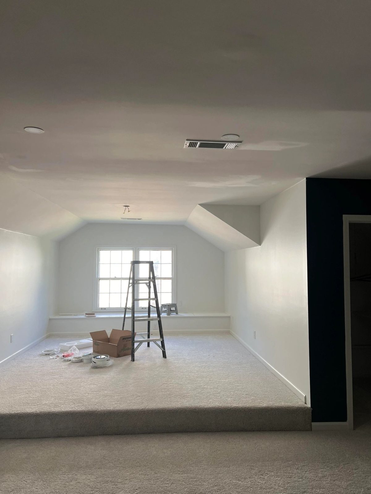 Finished bonus room with new lighting and HVAC
